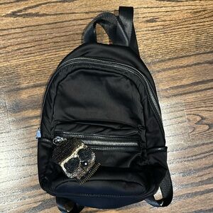Steve Madden backpack/purse w/ skull zipper

Never used in like new condition